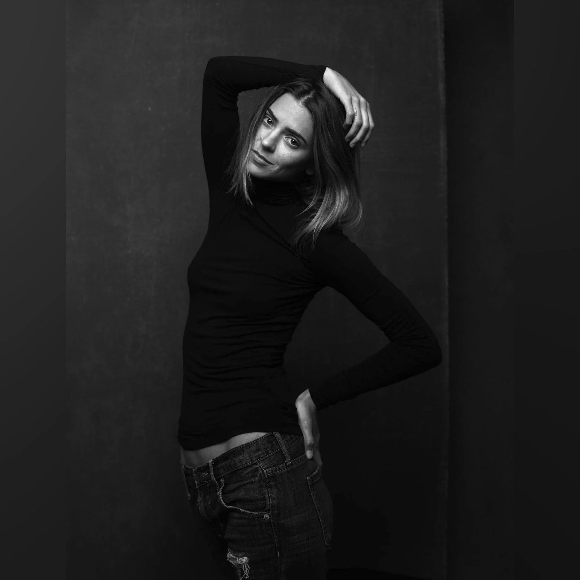 Fierce elegant brunette model headshot in black turtleneck